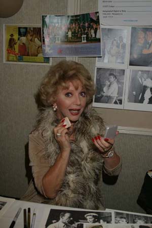 Ruta Lee puts on makeup before heading out the door to a charity event!